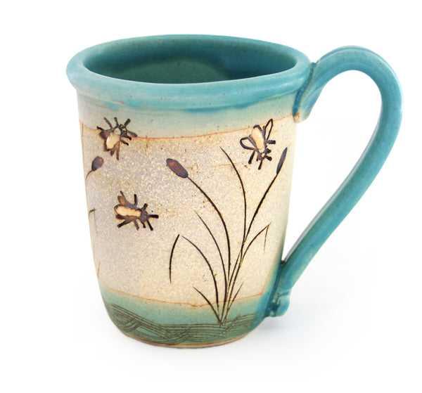 Coastal themed pottery, high fired stoneware mug with a hand etched design of bees flying over cattails